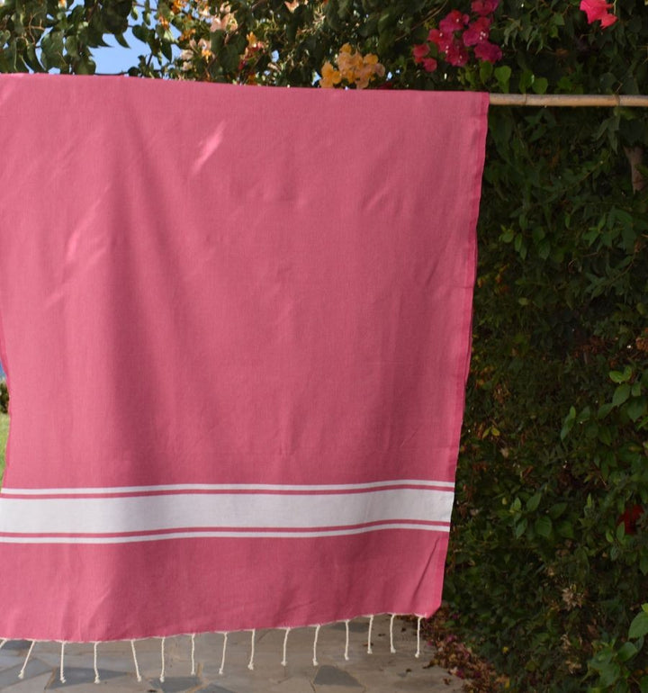 Telo mare in cotone riciclato rosa fucsia