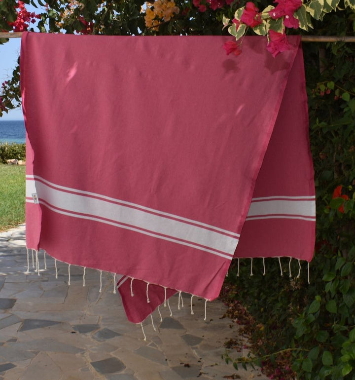 Telo mare in cotone riciclato rosa fucsia
