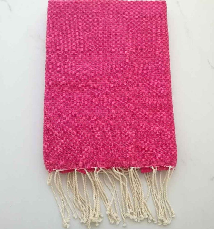 Fouta nido de abeja unido rosa fucsia