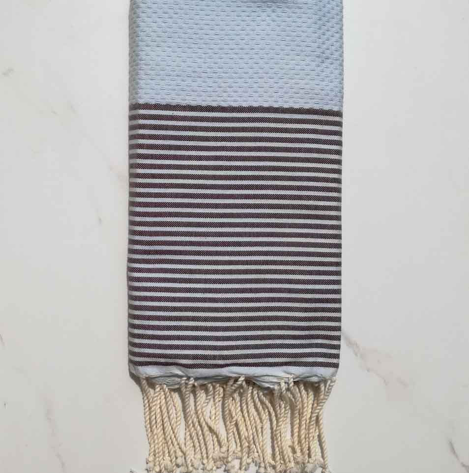 Fouta nid d'abeille bleu clair rayée marron 